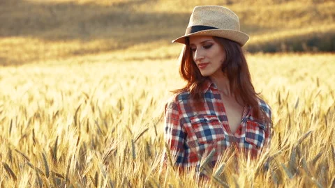 A young woman's hand touching the grass in a wheat field. Young farmer. Stock Footage 132139260