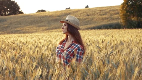 A young woman's hand touching the grass in a wheat field. Young farmer. Stock Footage 132139394
