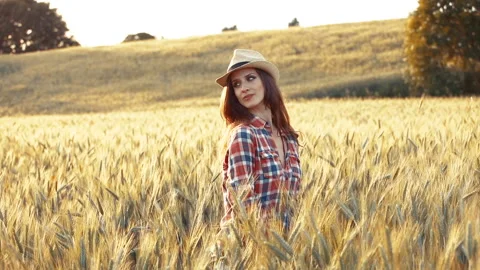A young woman's hand touching the grass in a wheat field. Young farmer. Stock Footage 132139422