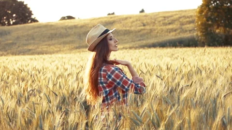 A young woman's hand touching the grass in a wheat field. Young farmer. Stock Footage 132139463