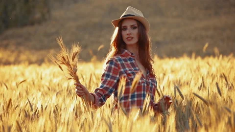 A young woman's hand touching the grass in a wheat field. Young farmer. Stock Footage 132139661