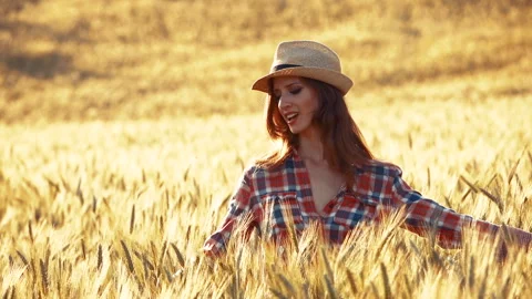A young woman's hand touching the grass in a wheat field. Young farmer. Stock Footage 132151887