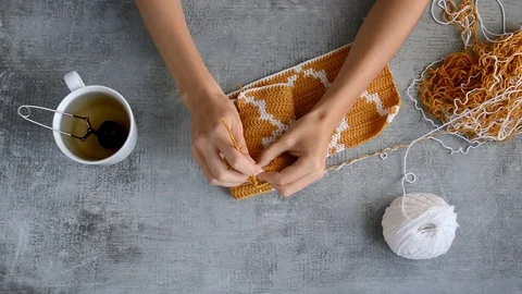 Young womans hands crocheting Stock Footage 117759735