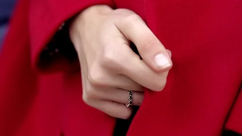 Young woman’s hands with rings on red wool coat Stock-Footage 75008042