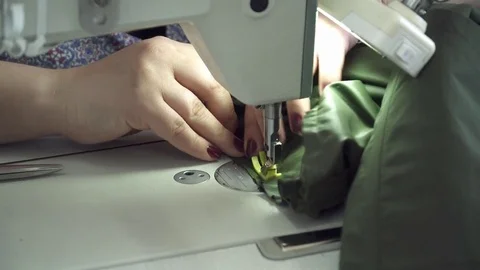 Young woman's hands sewing on the sewing machine Stock Footage 74421460