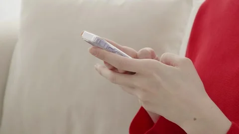 A young woman's hands as she text messages on her phone. Stock Footage 263701588
