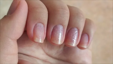 Young womans hands with simple modern creative manicure with show style and Stock Footage 313264808