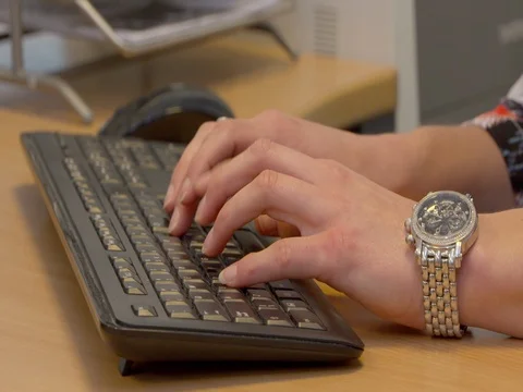 Young woman's hands typing at computer keybord Stock Footage 72947542