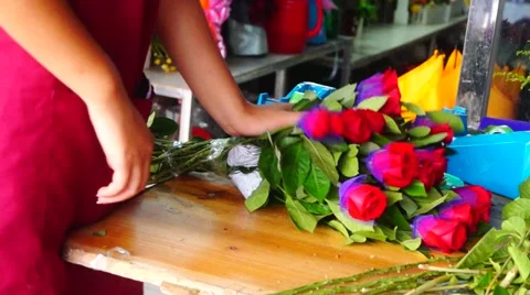 Young women are dressing up roses Stock Footage