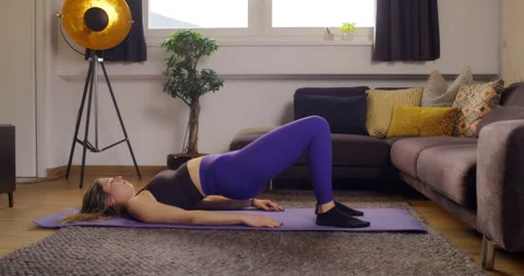 Young women does hip exercise at home. Training for the hip. Home workout. Stock Footage 170971674