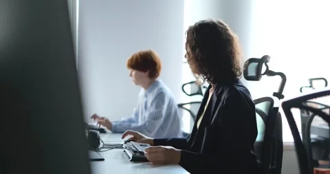 Young women soft ware developers working at big city IT office 4k Footage Video stock 242570716