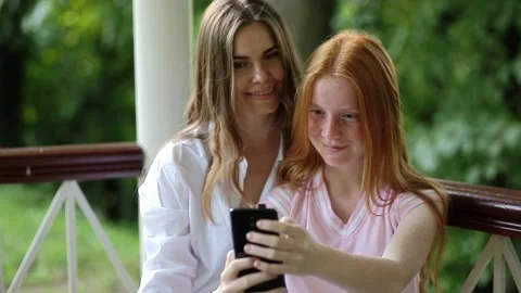 Young women taking selfie using the phone Video stock 166294027