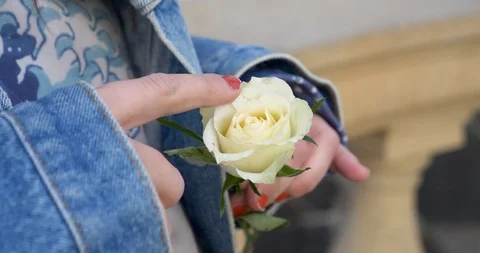Young women touching a flower Stock Footage