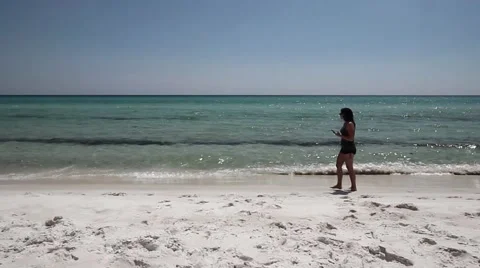 Young Women Using Her Cell Phone At The Beach Stock Footage 53494377