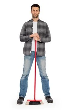 Young worker with a broom Stock Photos