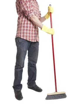 Young worker with a broom Stock Photos