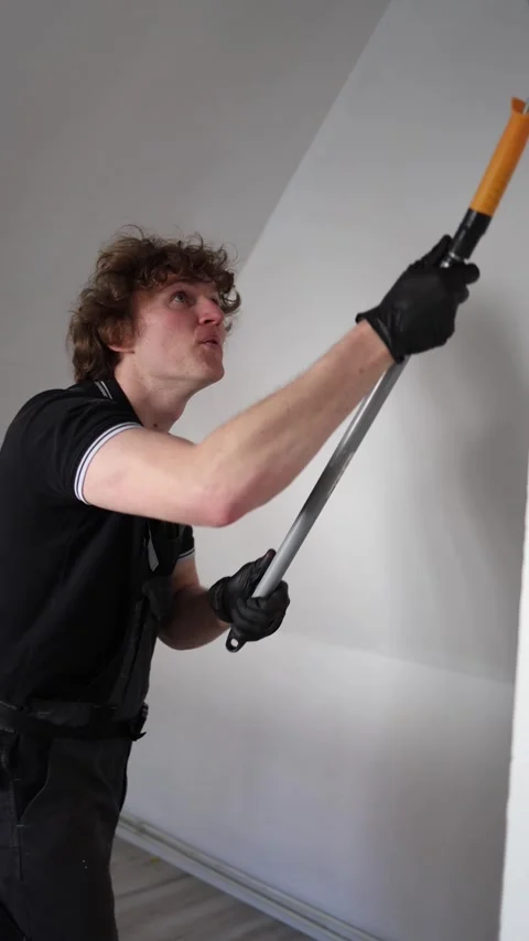 Young worker checking painted apartment Stock Footage 334592656