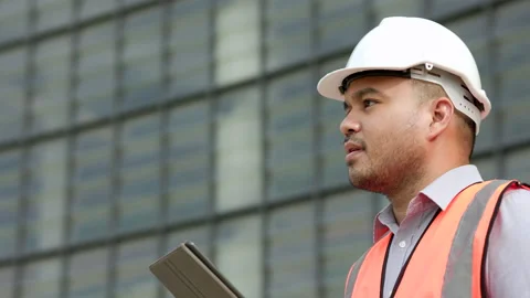 Young worker indian civil engineer using tablet planning the project build the m Stock Footage 162292957