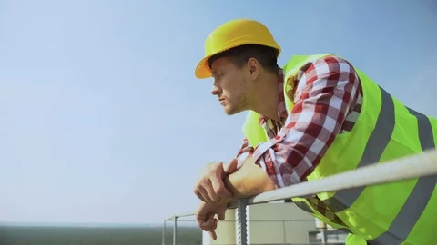 Young worker leaning building rails standing outdoors, construction occupation Stock-Footage 117213490