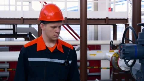 A young worker makes his first day at work at the plant bypassing the process Stock Footage 200314820