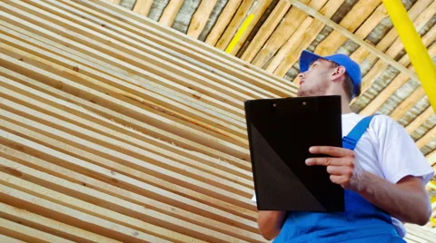 Young worker making an inventory of stock on wood Stock Footage 57094914