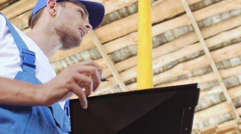 Young worker making an inventory of stock on wood Stock Footage 57095177