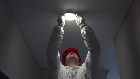 Young worker man installing led lights on ceiling hole Stock Footage 89822702
