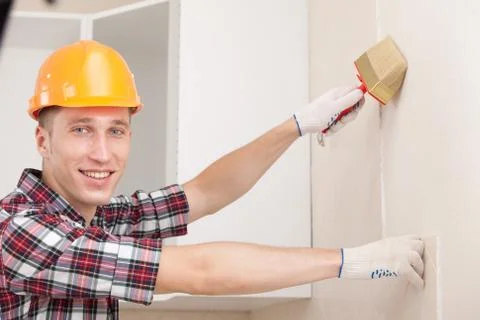 Young worker with paint brush Stock Photos