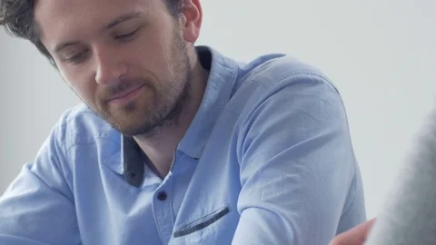 Young worker pointing at tablet screen while listening for observations. Stock Footage 82227512