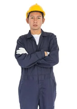 Young worker standing with arm crossed Stock Photos