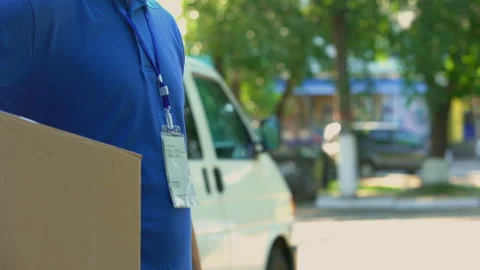 Young worker taking and counting money for parcel delivery student part-time job Video stock 91236825