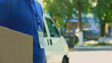 Young worker taking and counting money for parcel delivery student part-time job Video stock 91241960