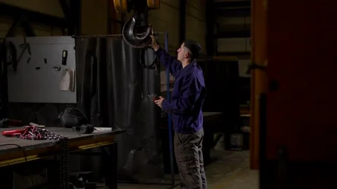 Young worker using heavy materials Stock Footage 267044863