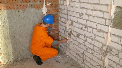 Young Worker working With Level on the floor Stock Footage 71939359