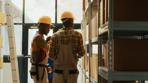 Young workers scanning boxes with barcodes Stock Footage 234937002