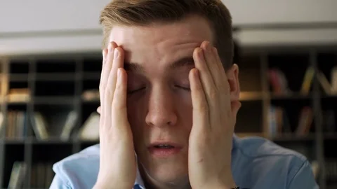 Young working man is very tired and overworked because of stressful and pressure Stock Footage 79931091