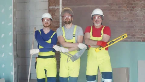 Young workmen in helmet enjoy dancing at construction site Stock Footage 133635314