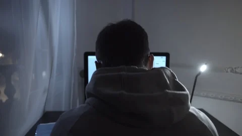 Young writer struggling with script writing on computer at night in room Stock Footage 85706604