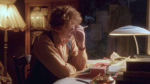 Young Writer Taking Notes and Puffing on Cigarette in Deep Contemplation Video stock 285094205