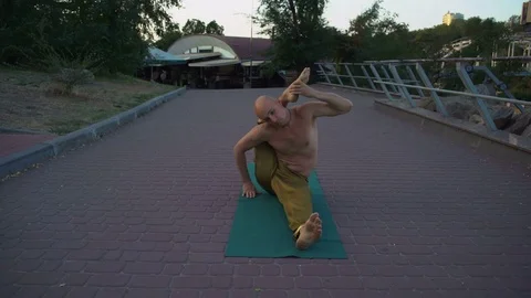 Young Yogi with Naked Torso Performs Complex Asana in Morning Training Process Stock Footage 85333722