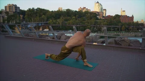 Young Yogi Performs Asanu Scrolling Standing on the Green Rug on the Morning Stock Footage 85332335