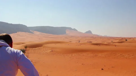 Young_Man_Running_In_The_Desert Stock Footage 35638104