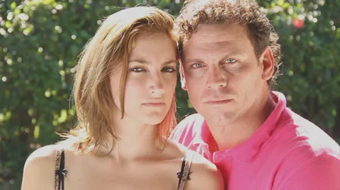 Young,blond couple look at camera very serious Stock Footage 38762589