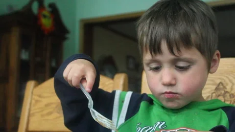Youngboy eating with a fork Video stock 107679668