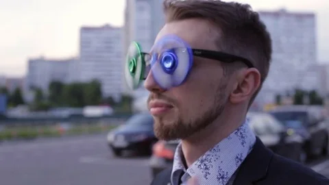 Younge man with the spinner glasses Stock Footage 77546065
