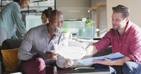Younger man swiping translucent AR interface in office, streaming shipment Stock Footage 315538999