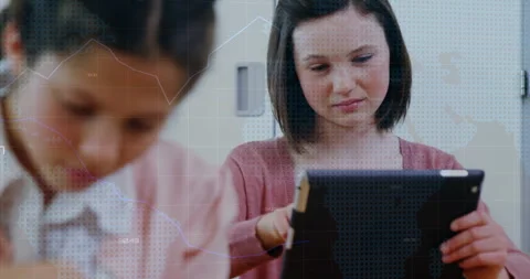 Younger student scribbling notes while teen tapping tablet generating animated Stock Footage 316190837