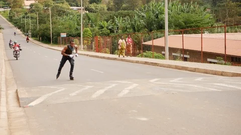 Youngman rollerblading on the road Stock Footage 113060739