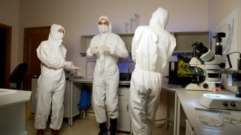 Youngs scientists dancing in laboratory Stock Footage 127560818