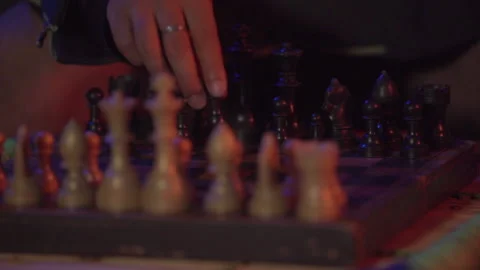A youngster playing chess feeling alone in the room. Vidéo 144802625